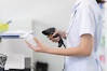 Pharmacist_scanning_bottle