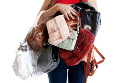 Woman carrying many handbags