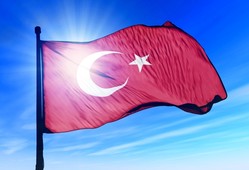 Sun behind Turkish flag