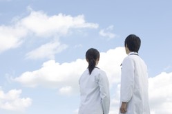 Healthcare workers gaze at clouds