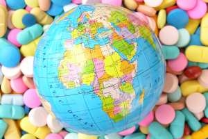 Globe showing Africa on bed of pills