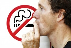 Man smoking no-smoking sign Man smoking no-smoking sign